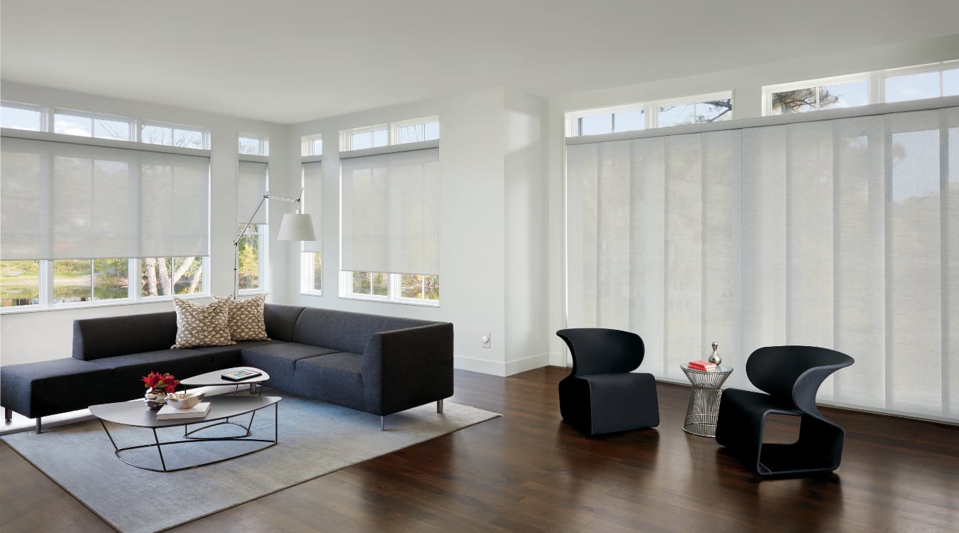 Roller shades can add a hint of elegance to any formal room. Roller shades in a formal living room